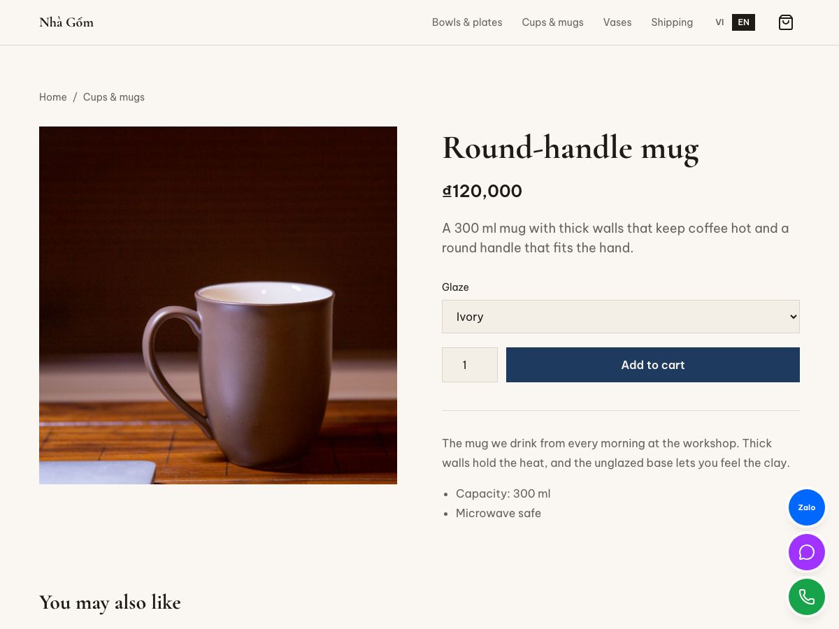 Round-handle mug product page with a photo, price, glaze options and an add to cart button